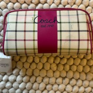 Coach zip up bag multi colored.